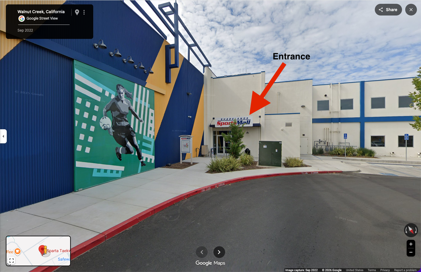 Photo of the Shadelands Sportsmall east entrance in Walnut Creek with the SportsMall sign above the door